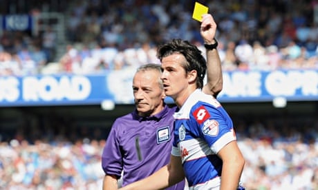 QPR's Joey Barton is shown a yellow card