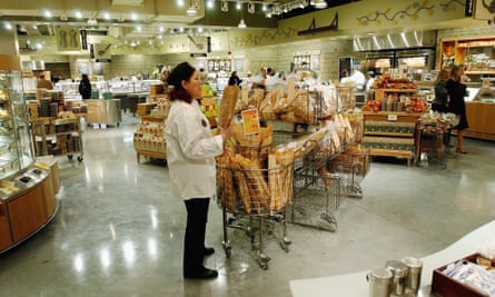 A clerk in the bread department of a Whole Foods 