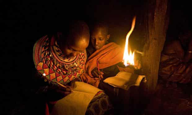 Children studying at night using a flame on a stick. How could regular affordable energy change educ