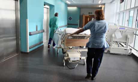 A patient being taken to an operating theatre in a hospital