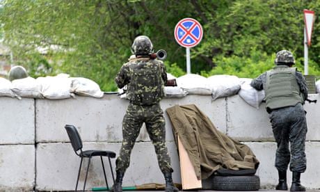Ukrainian soldiers guarding a checkpoint