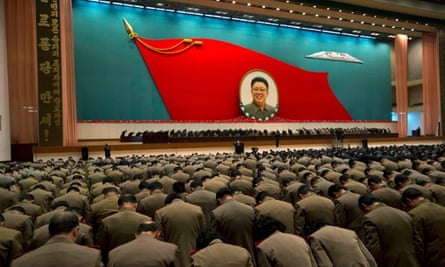 North Korean military officers bow at an image of late North Korean leader Kim Jong-il during a national meeting of top party and military officials in 2012.