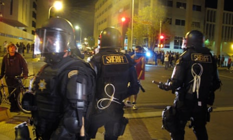 in March, riot police stood by a crowd protesting police shootings in Albuquerque.