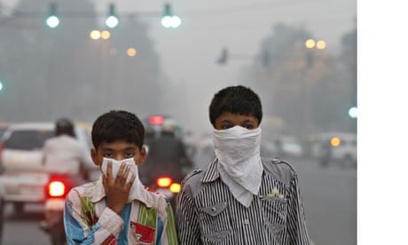 Children protect their faces from Delhi's smog. 