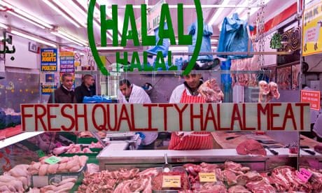 A butcher in Shepherd's Bush market selling halal meat