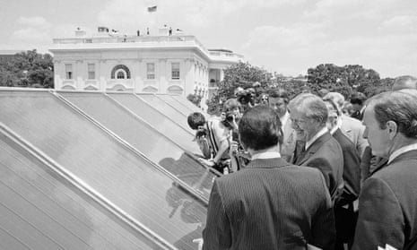 In this June 20, 1979, file photo President Jimmy Carter, center, is surrounded by reporters and photographers as he inspected new White House solar hot water heating system located on the roof of the West Wing of the mansion, over the Cabinet Room. The Obama White House will announce Tuesday, Oct. 5, 2010, that the most famous residence in America plans to install solar panels for the first time atop the White House's living quarters. The solar panels _ which will be installed by spring 2011 _ will heat water and supply some of the first family's electricity.