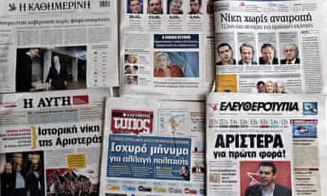 Greek newspapers are on display in Athen