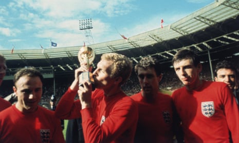 England captain Bobby Moore kissing the Jules Rimet trophy as the team celebrate winning the 1966 World Cup final against Germany at Wembley Stadium. Also pictured, left to right, George Cohen, Geoff Hurst and Martin Peters.
