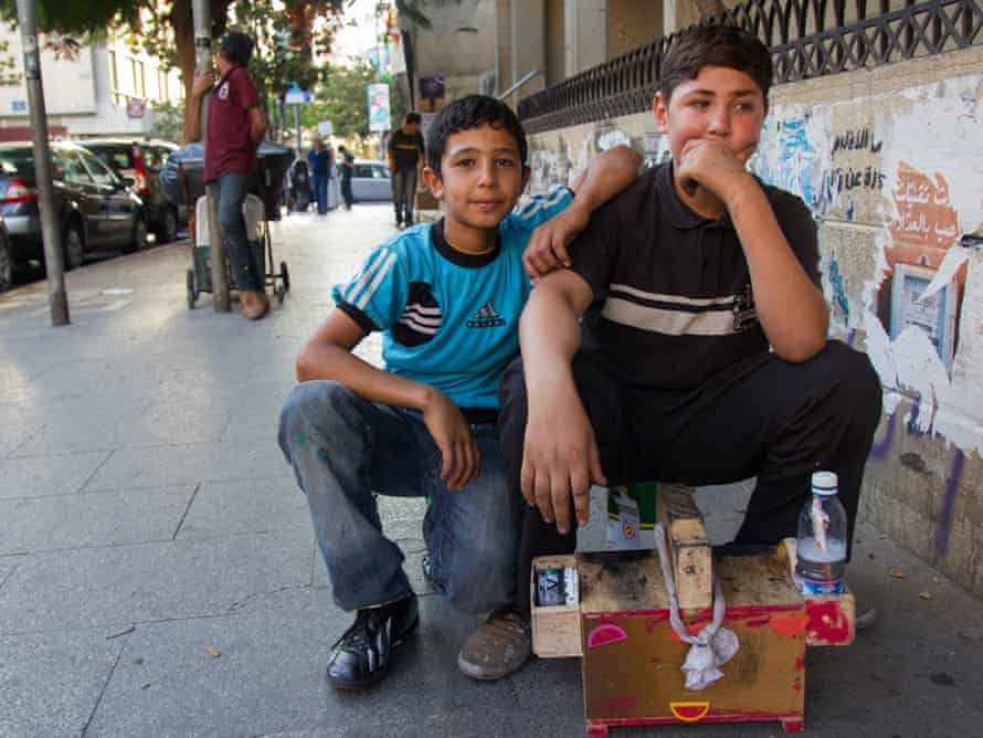 Mohammed, 12, and Mohammed, 16 (no surnames given), are working as shoe-shine boys.  They were not working in Syria, but were in school.  They are not attending school at all in Lebanon.