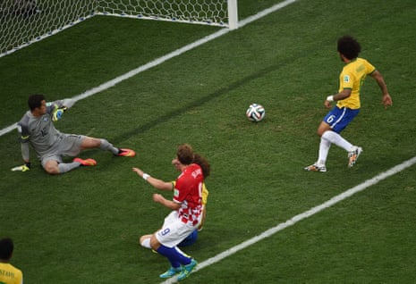 Brazil's defender Marcelo inadvertently turns the ball into his own net to give Croatia the lead.