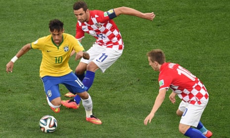 Brazil's forward Neymar races away with the ball.