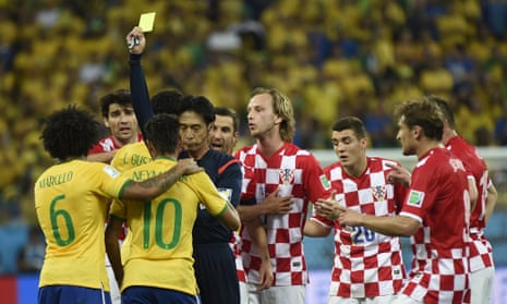 Neymar picks up the first yellow card for flinging his arm into the face of Luka Modric.