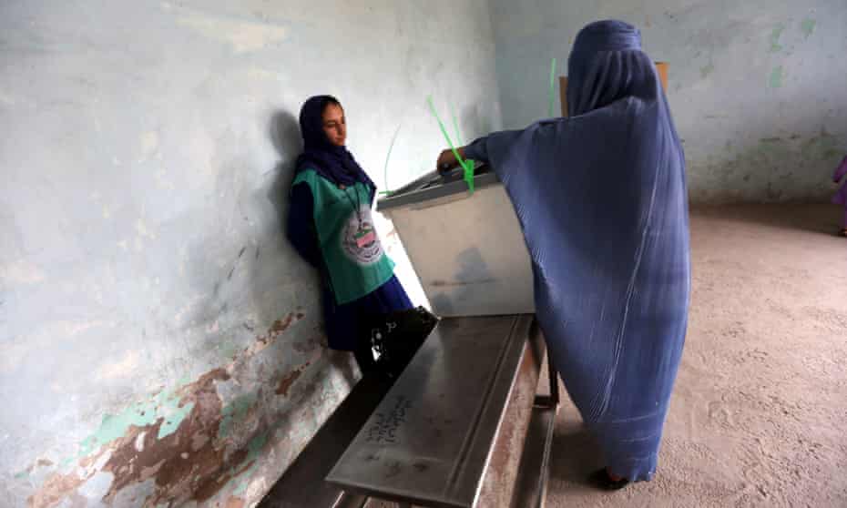 An Afghan woman casts her ballot at a polling station in Herat.