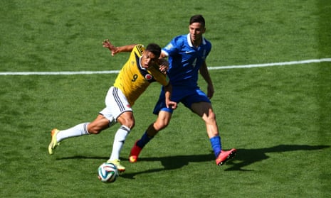 Teofilo Gutierrez of Colombia is challenged by Konstantinos Manolas of Greece.
