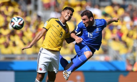 Greece's defender Vasilis Torosidis vies with Colombia's forward Teofilo Gutierrez.