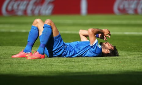 Giorgos Samaras of Greece reacts after falling to the ground against Colombia.