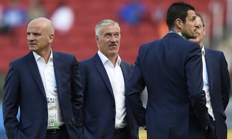 France's assistant coach Guy Stephan, head coach Didier Deschamps and goalkeepers' coach Franck Raviot inspect the pitch ahead of the Group E football match between France and Honduras at the Beira-Rio Stadium in Porto Alegre.