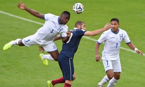 Honduras' defender Maynor Figueroa. left, jumps on the back of France's Karim Benzema to win teh ball.