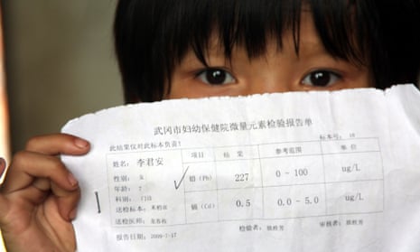 A Chinese kid shows her blood test report which showed there was excessive levels of lead in her blood, in Hengjiang village, Wugang city, central Chinas Hunan province, Tuesday, August 18, 2009. Authorities in central Chinas Hunan Province have shut down a smelter and detained two of its executives after more than 1,300 local children were suspected to have lead poisoning, the second such scandal in the country within a month.