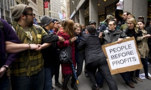 A businessman tries to break through a line of Occupy Wall Street protesters who had blocked access to the New York Stock Exchange area in November 2011.