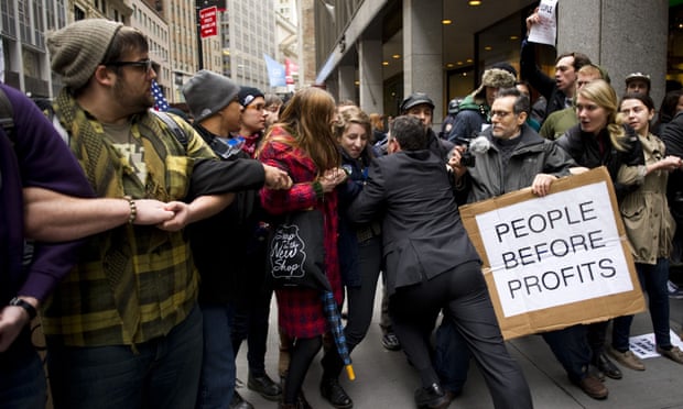 A businessman tries to break through a line of Occupy Wall Street protesters who had blocked access to the New York Stock Exchange area in November 2011.