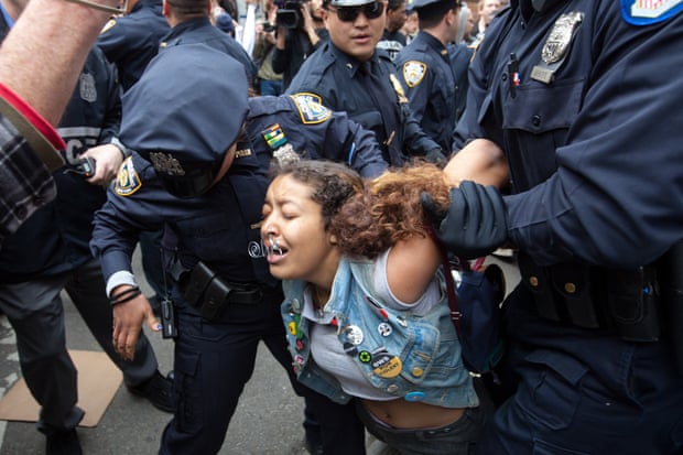 A protester carried away after being arrested by police during an Occupy Wall Street march from Zuccotti Park to Union Square.