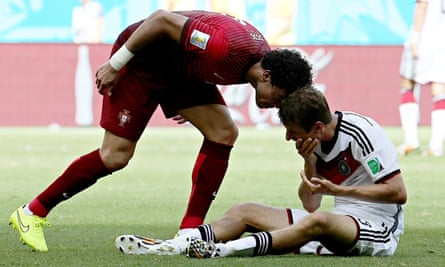 Pepe of Portugal (L) argues with Thomas Mueller