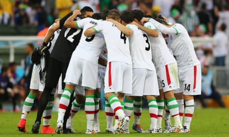 The Iran players huddle as well.