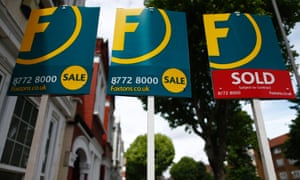 Estate agents boards lined up outside houses in south London this month.