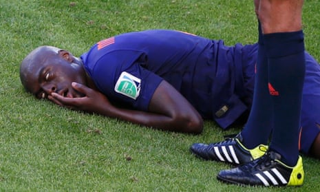 Bruno Martins Indi lies on the floor in pain.