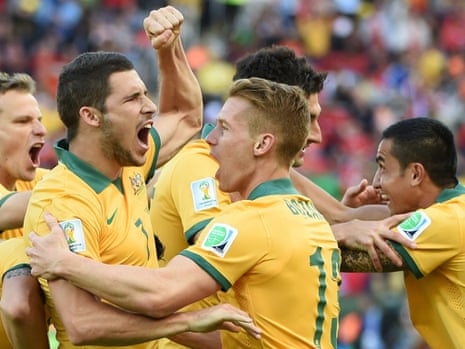 Australia's players celebrate after scoring their second goal.