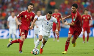 Chile's forward Alexis Sanchez charges forward against Spain.