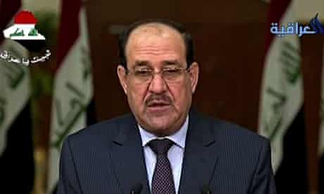 A grim-faced Nouri al-Maliki speaks on Iraqi TV