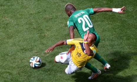 Its a good game without too many clear chances. Ivory Coast's Geoffroy Serey challenges Colombia's James Rodriguez.