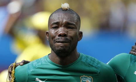 Ivory Coast's midfielder Geoffroy Serey Die is overcome with emotion as he listens to his national anthem before the start of the match.