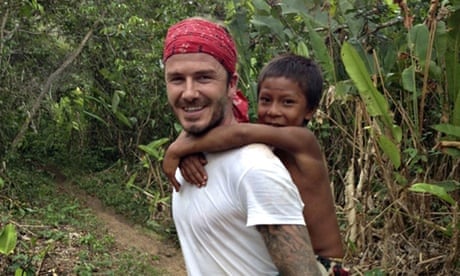 David Beckham is dapper as he flies home from Brazil