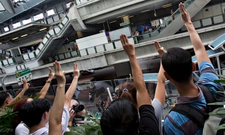 Protesters give the salute in Bangkok, Thailand.