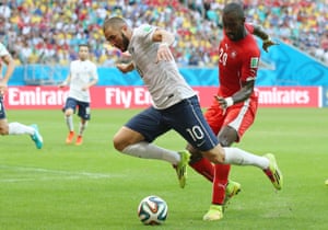 Johan Djourou sticks out a clumsy leg and down goes Karim Benzema.