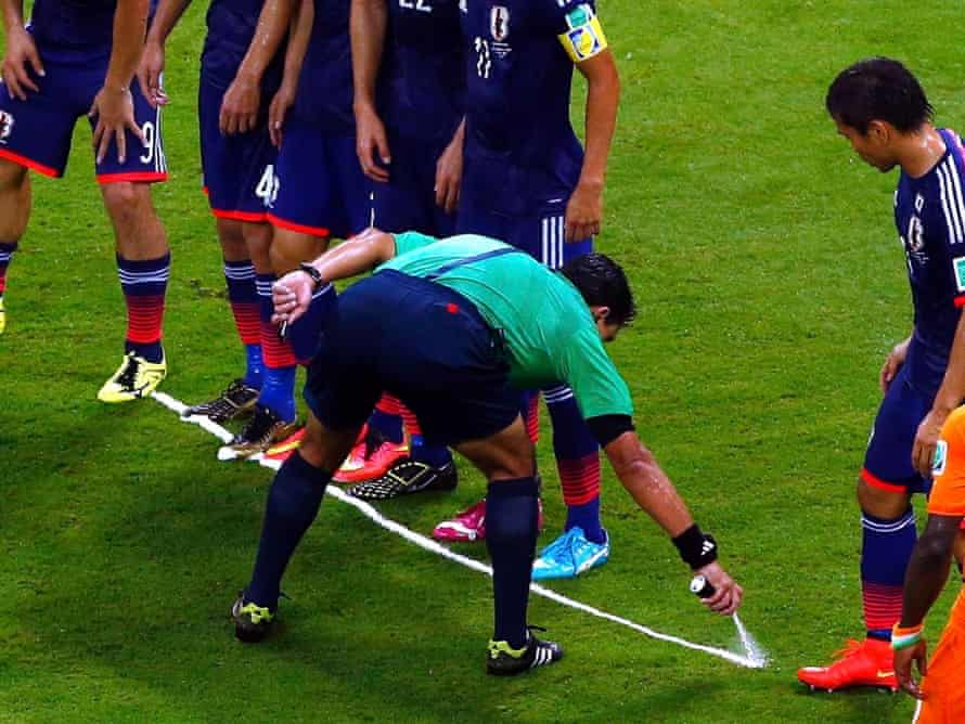 Referee Enrique Osses makes his mark.