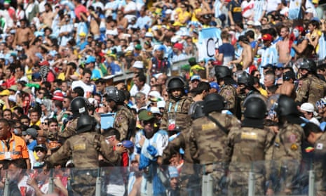 Military police blend in with the crowd at the Mineirao Stadium.