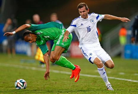 Peter Odemwingie tussles with Senad Lulic.