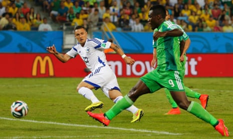 Nigeria's Emmanuel Emenike's shot is blocked by Begovic's legs, the goalkeeper out to face him so quickly.