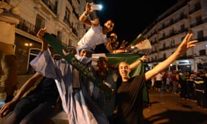 Fans in Algiers celebrate their team's first World Cup win in 32 years after Algeria beat South Korea 4-2