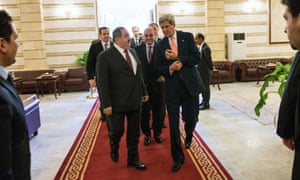 Iraqi Foreign Minister Hoshyar Zebari escorts U.S. Secretary of State John Kerry to meet with Prime Minister Nuri al-Maliki in Baghdad