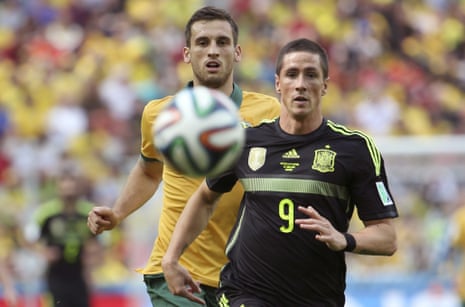 Spiranovic and Torres chase the ball as Spain begin to exert some pressure.