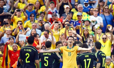 Australia's Ryan McGowan looks despondent as Spain's players celebrate.