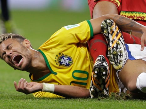 Brazil's Neymar cries in pain after colliding with Cameroon's Joel Matip.