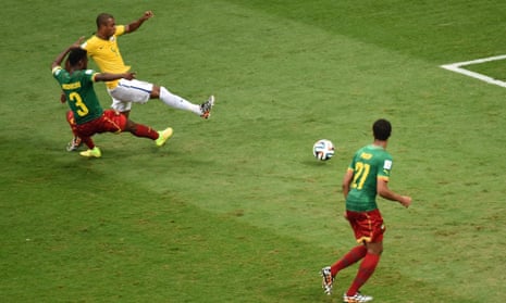 Brazil's midfielder Fernandinho strikes and scores the fourth...