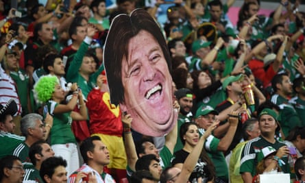 Mexico's fans hold up a cardboard cutout of Herrera  in Recife.