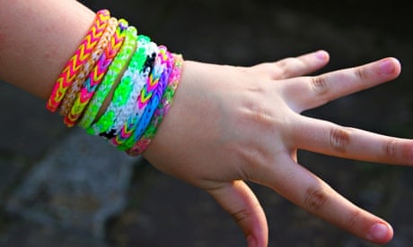 Colorful rubber rainbow loom band bracelets on wrist, trendy kids